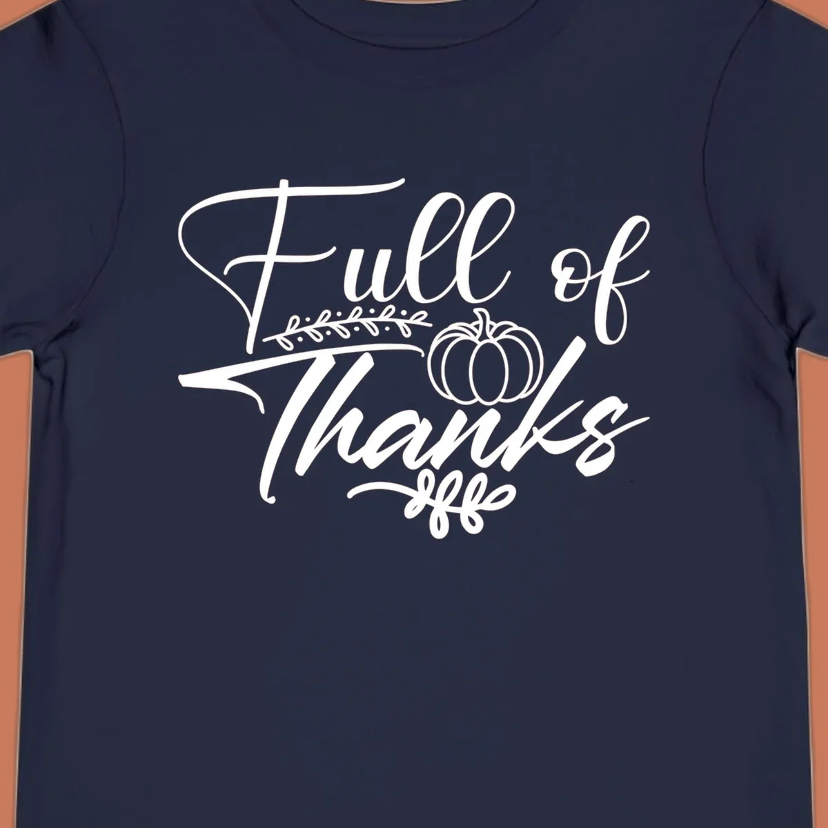 Elegant white script typography 'Full of Thanks' with pumpkin and leaf vine graphic for gratitude themes.