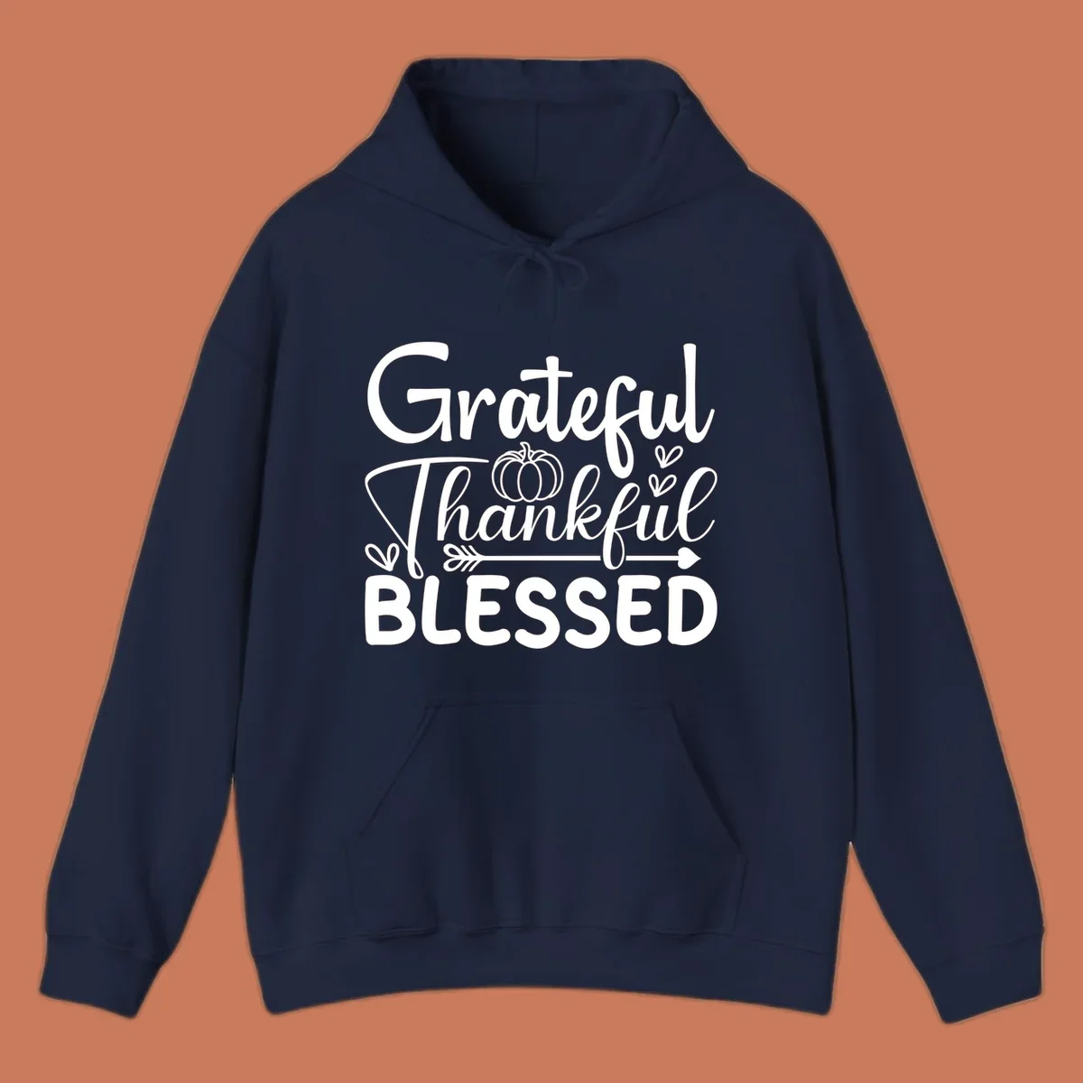 Grateful Thankful Blessed typography design with pumpkin, hearts, and arrow.