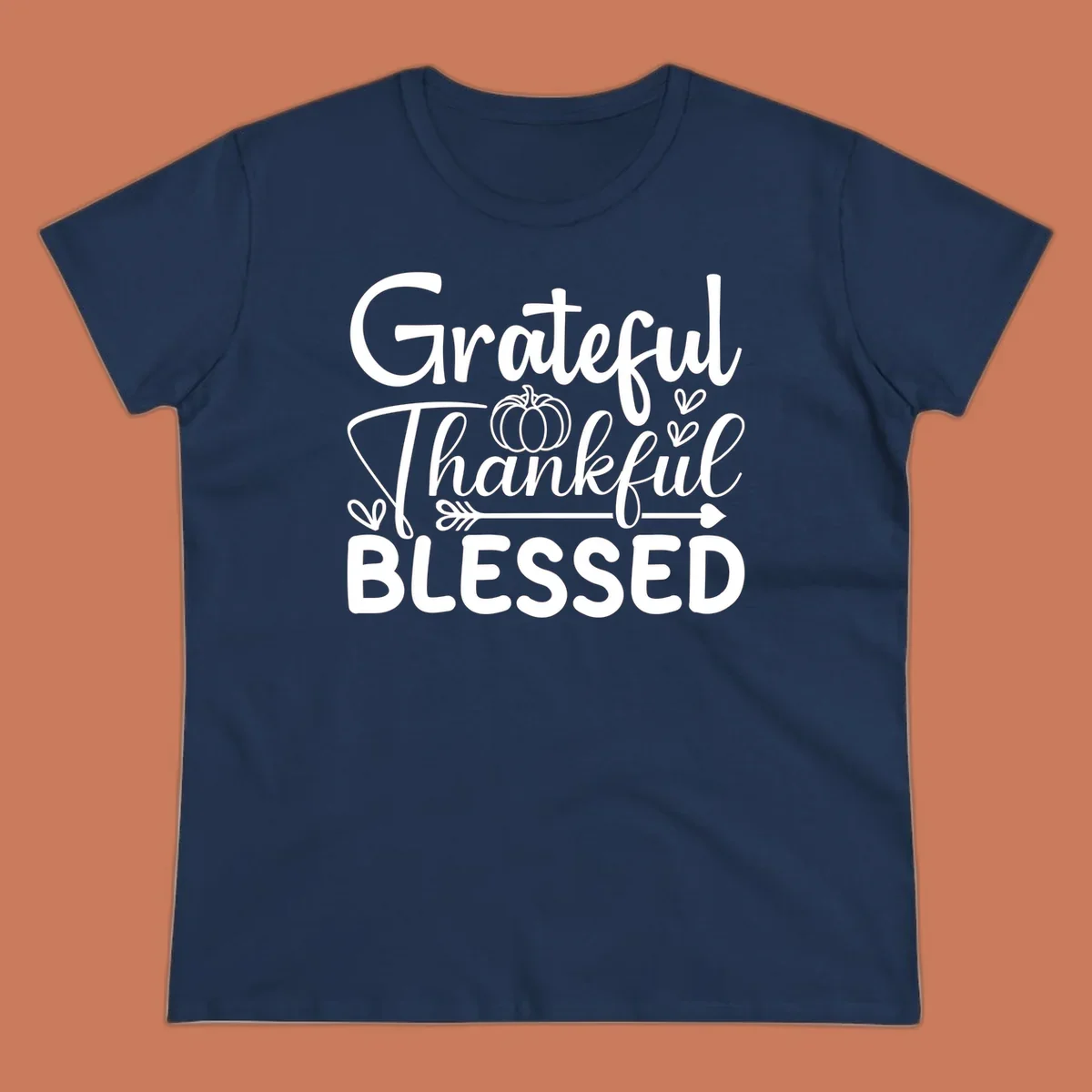 Grateful Thankful Blessed typography design with pumpkin, hearts, and arrow.