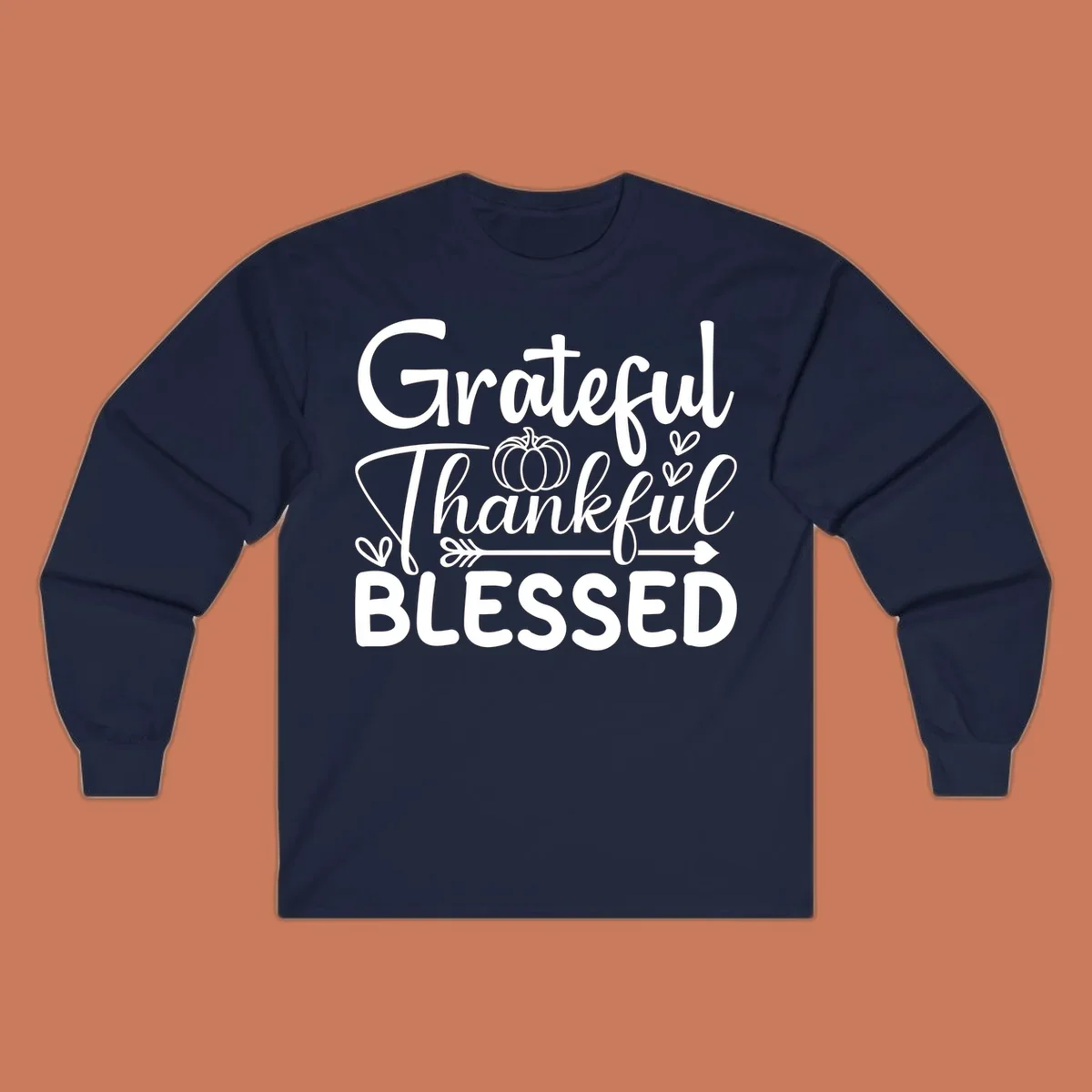 Grateful Thankful Blessed typography design with pumpkin, hearts, and arrow.