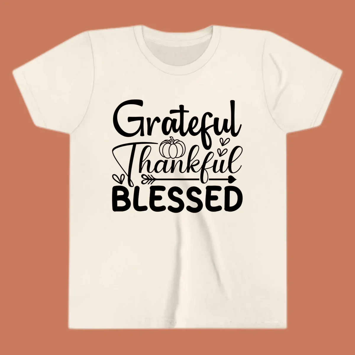 Grateful Thankful Blessed typography design with pumpkin, hearts, and arrow.