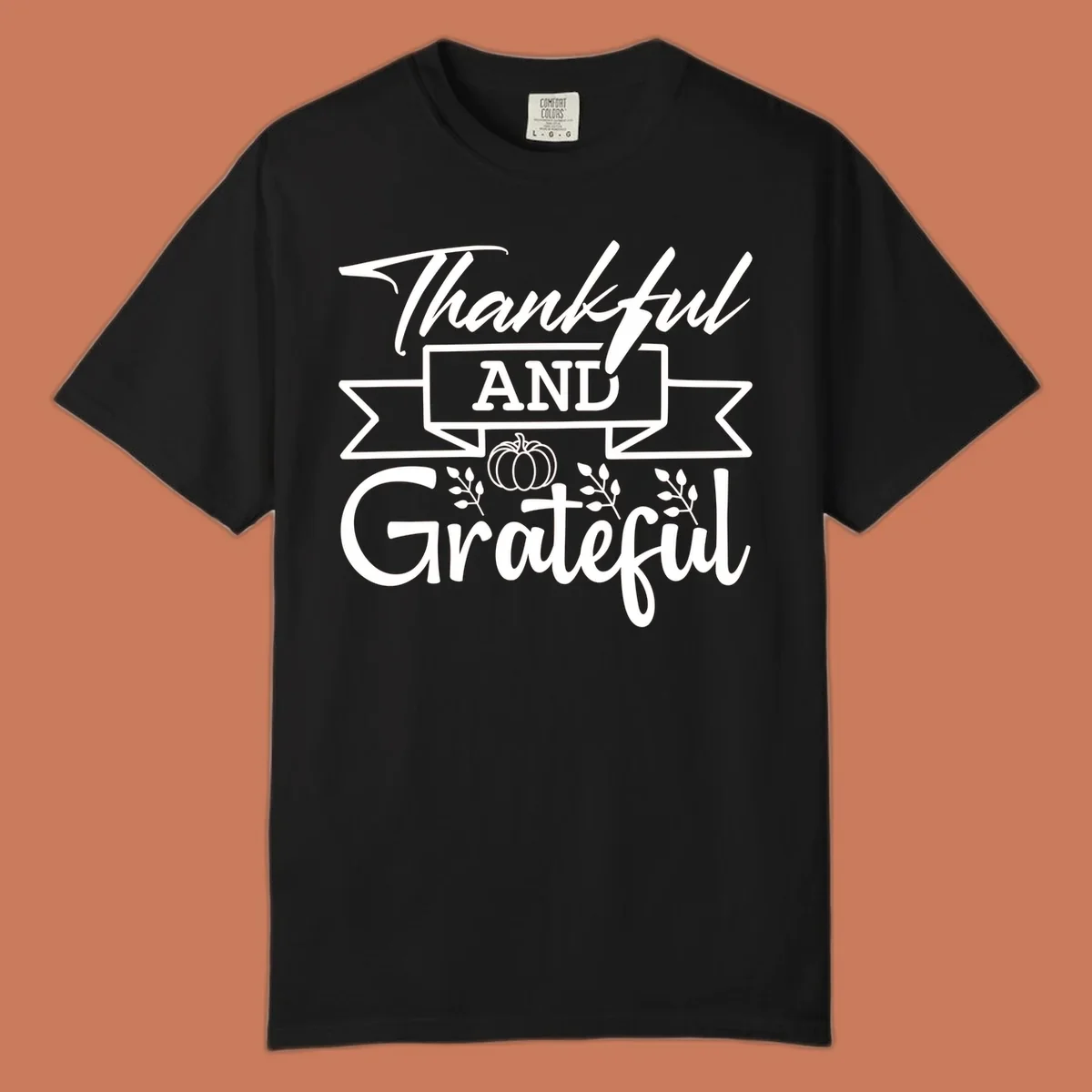 Thankful and Grateful autumn design with pumpkin and leaves.