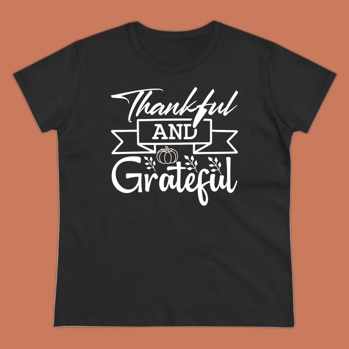 Thankful and Grateful autumn design with pumpkin and leaves.