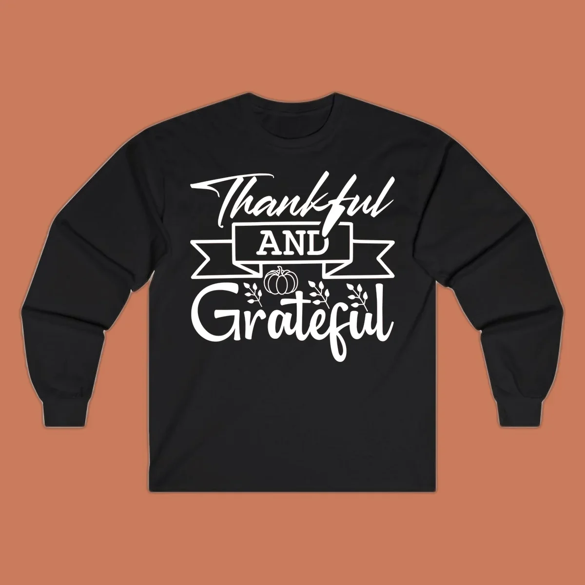 Thankful and Grateful autumn design with pumpkin and leaves.