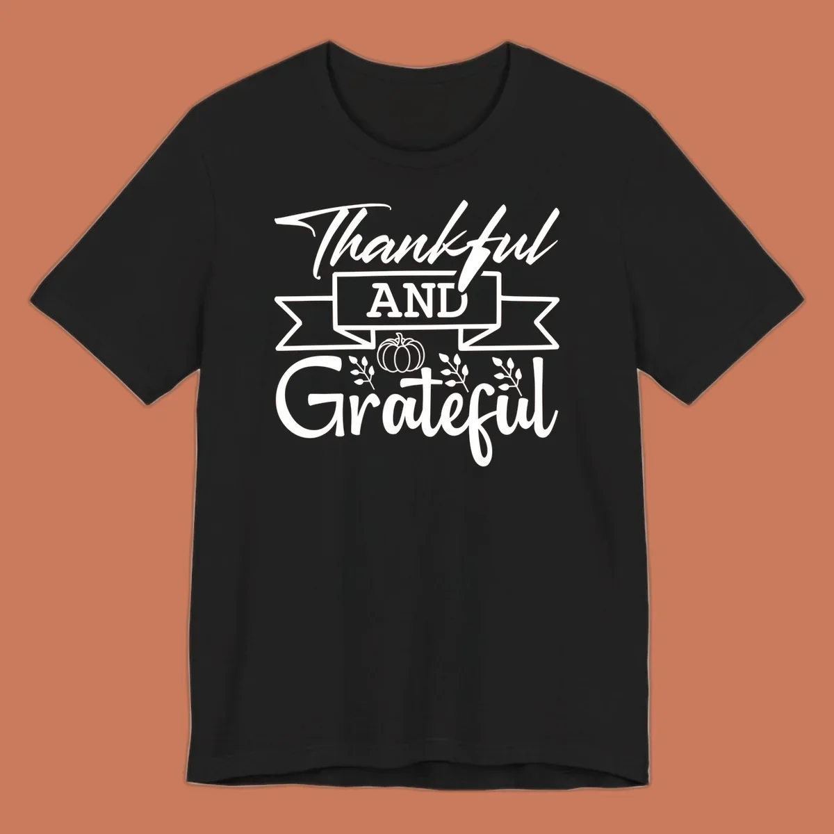 Thankful and Grateful autumn design with pumpkin and leaves.
