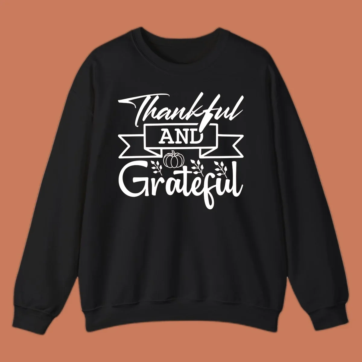 Thankful and Grateful autumn design with pumpkin and leaves.
