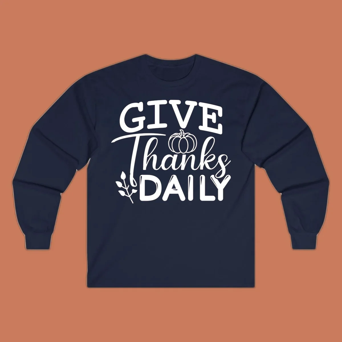 Give Thanks Daily text with a pumpkin and leaf sprig.