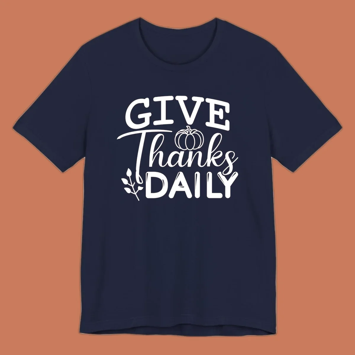 Give Thanks Daily text with a pumpkin and leaf sprig.