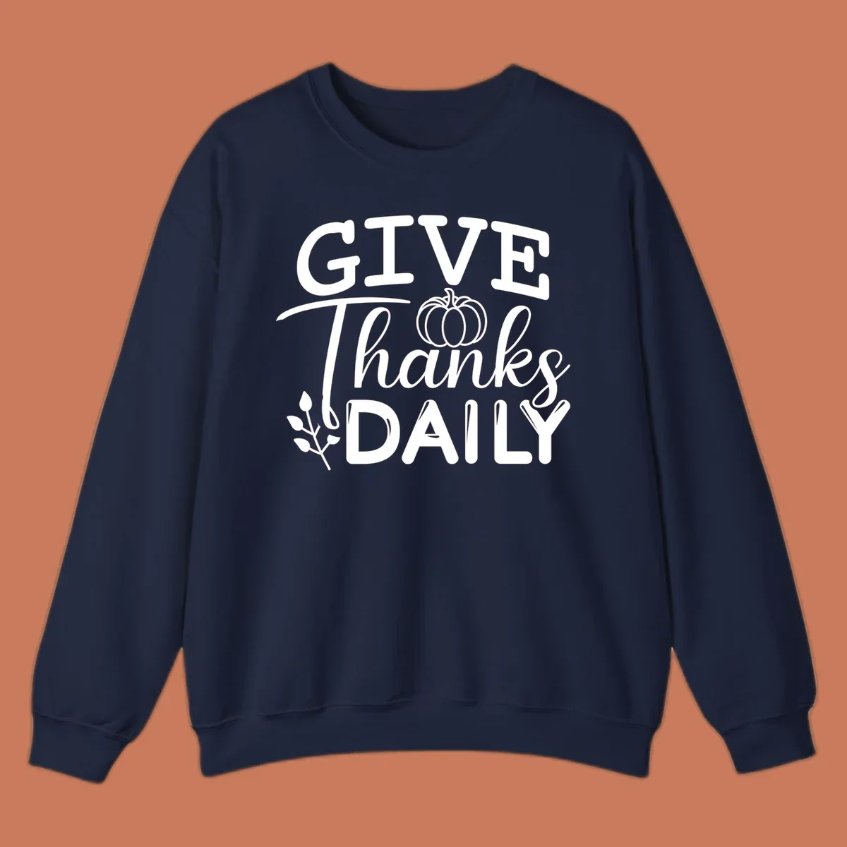 Give Thanks Daily text with a pumpkin and leaf sprig.