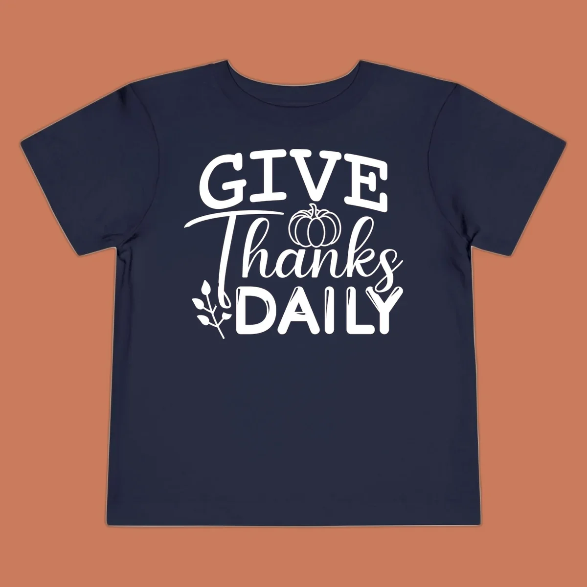 Give Thanks Daily text with a pumpkin and leaf sprig.