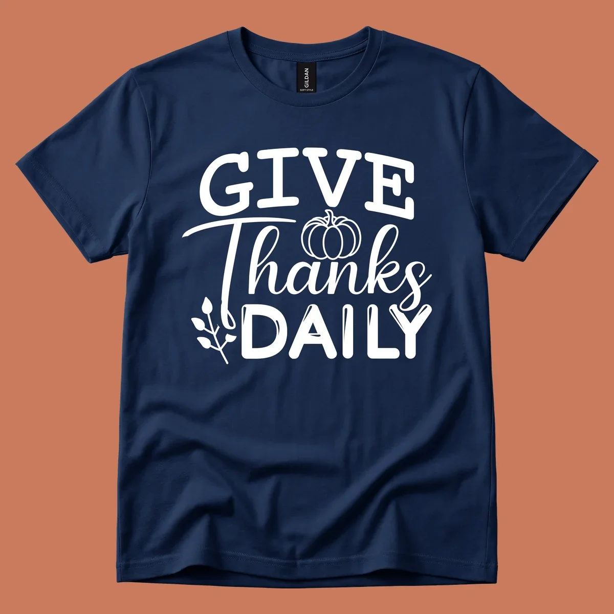 Give Thanks Daily text with a pumpkin and leaf sprig.