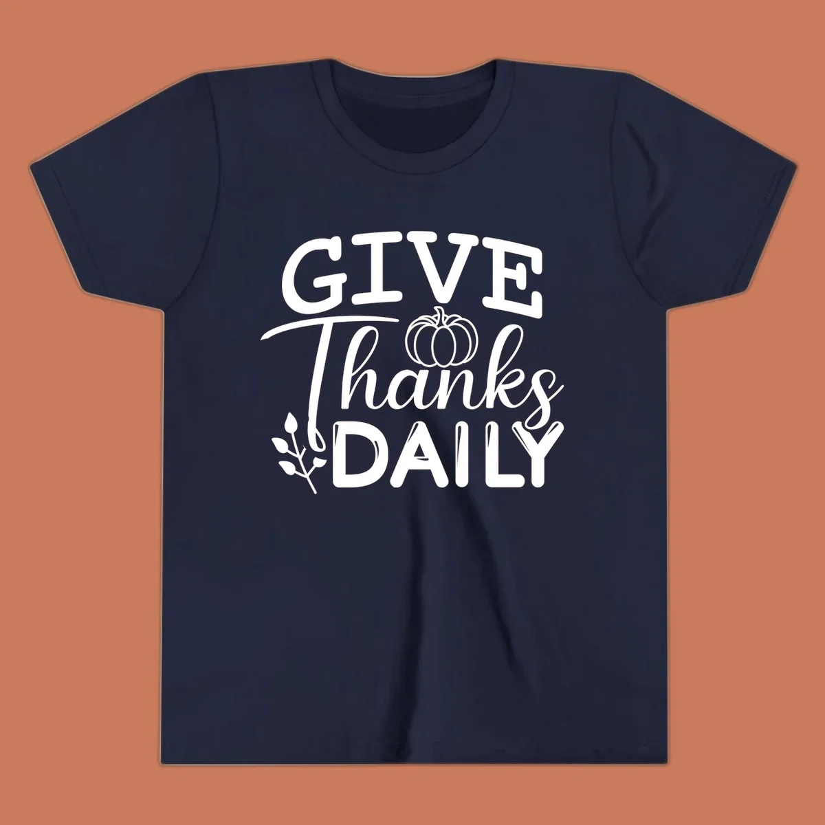 Give Thanks Daily text with a pumpkin and leaf sprig.