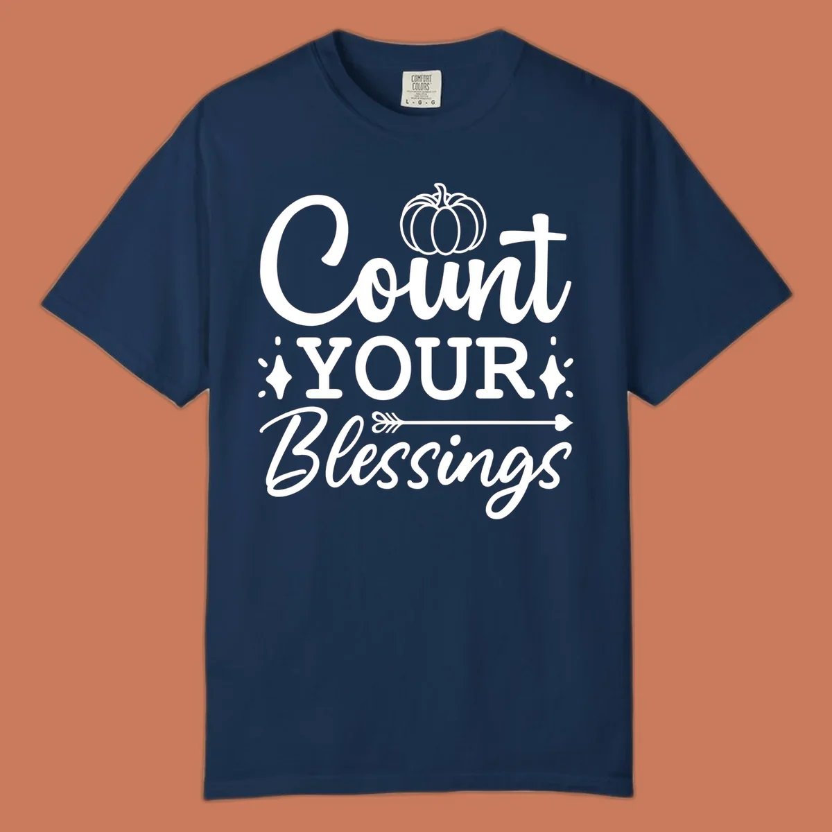 Count your blessings text with pumpkin and arrow graphic, in white.