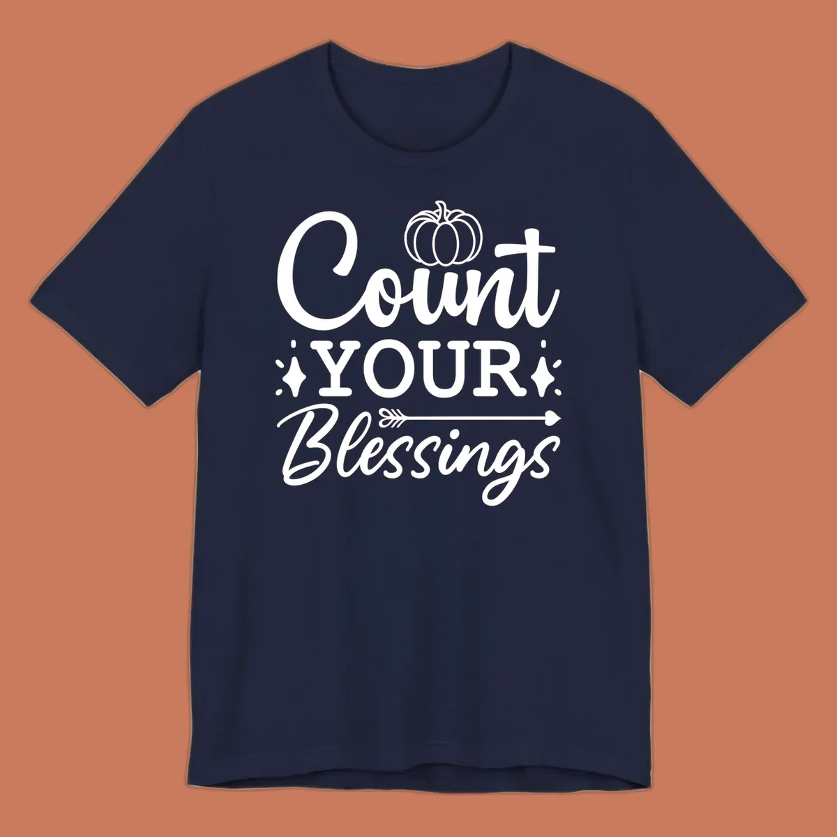 Count your blessings text with pumpkin and arrow graphic, in white.