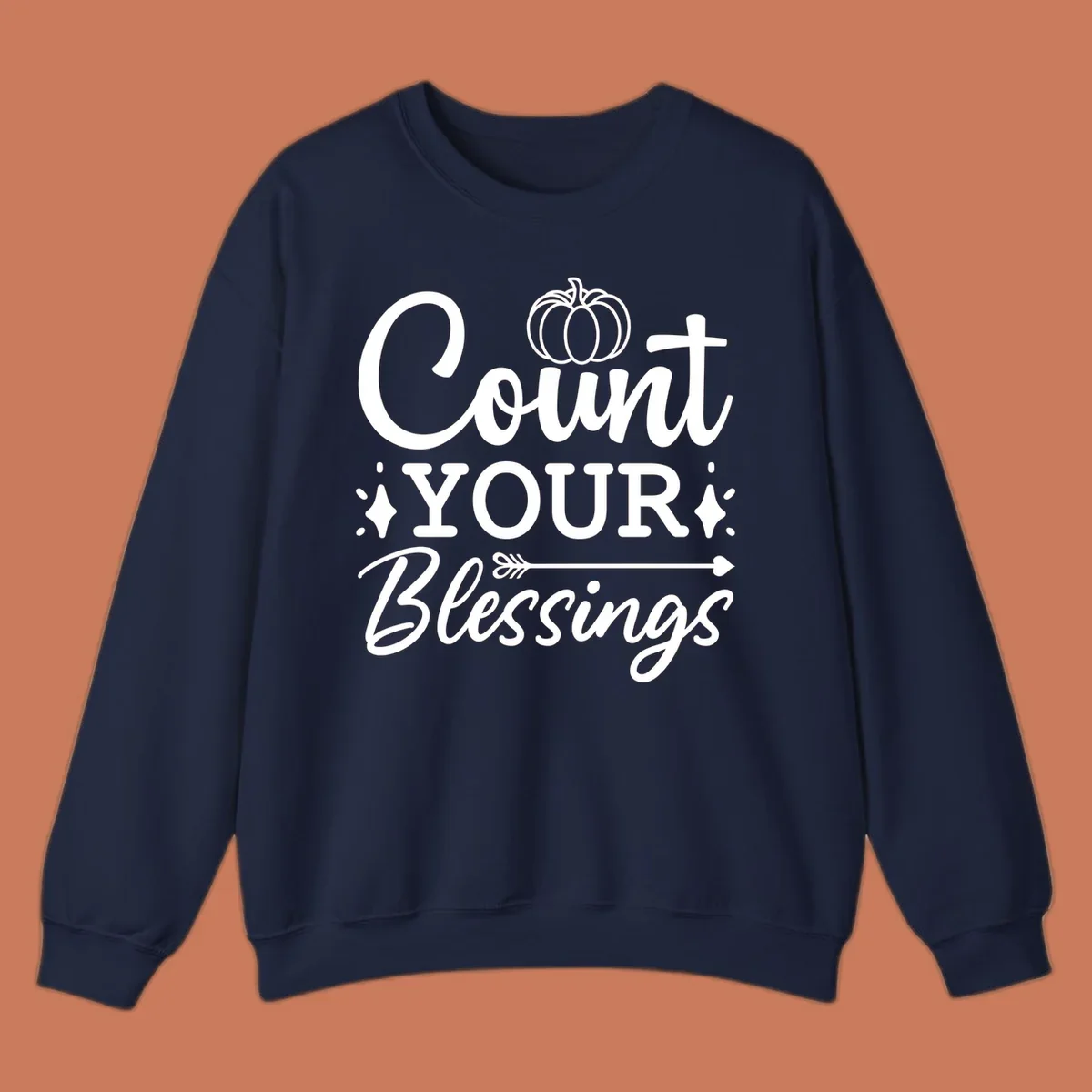 Count your blessings text with pumpkin and arrow graphic, in white.