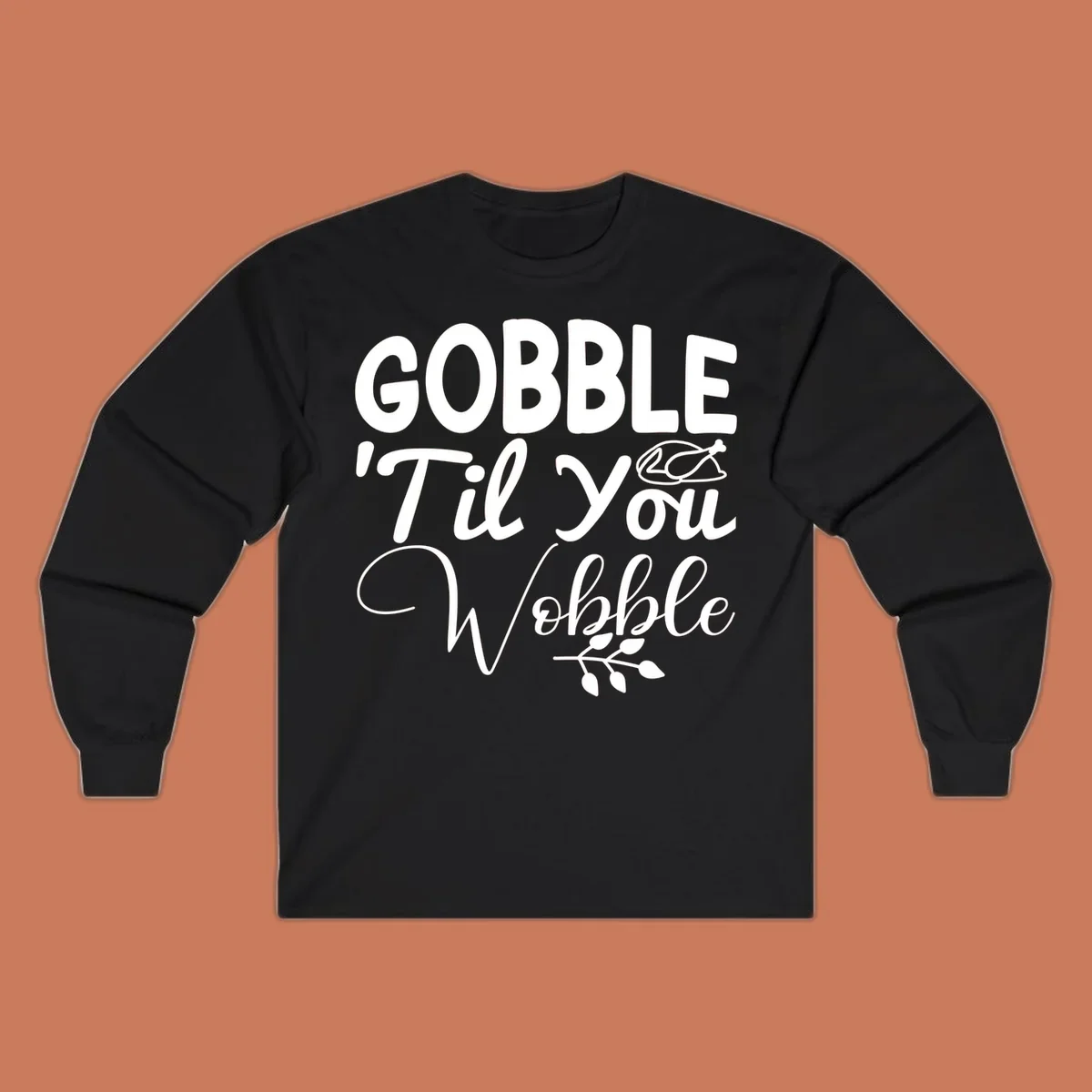 Gobble wobble thanksgiving phrase with roasted turkey illustration and leafy branch.