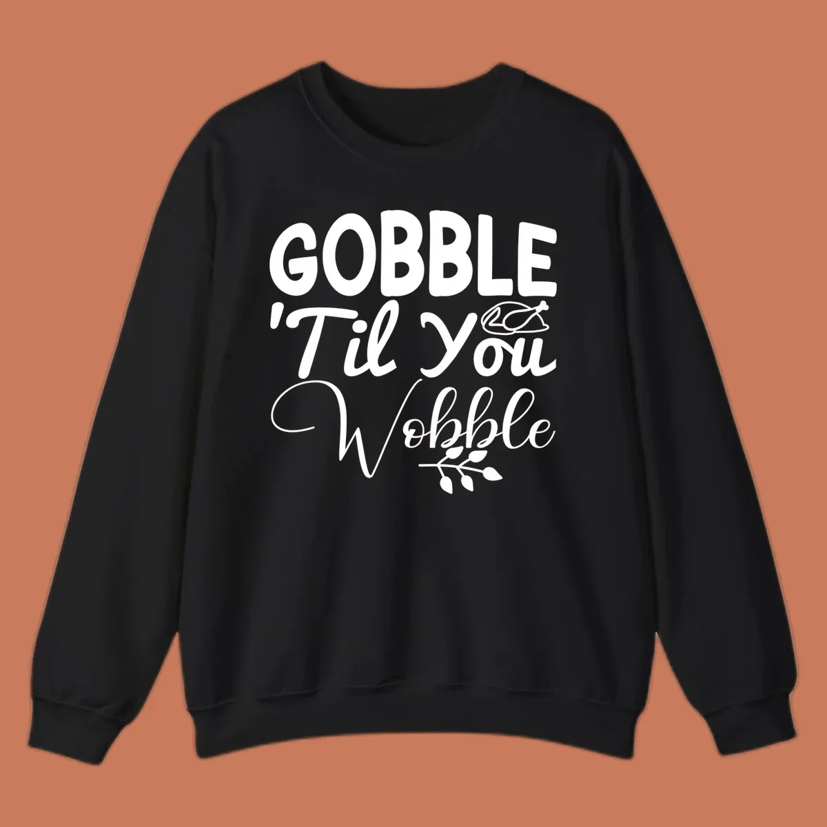 Gobble wobble thanksgiving phrase with roasted turkey illustration and leafy branch.