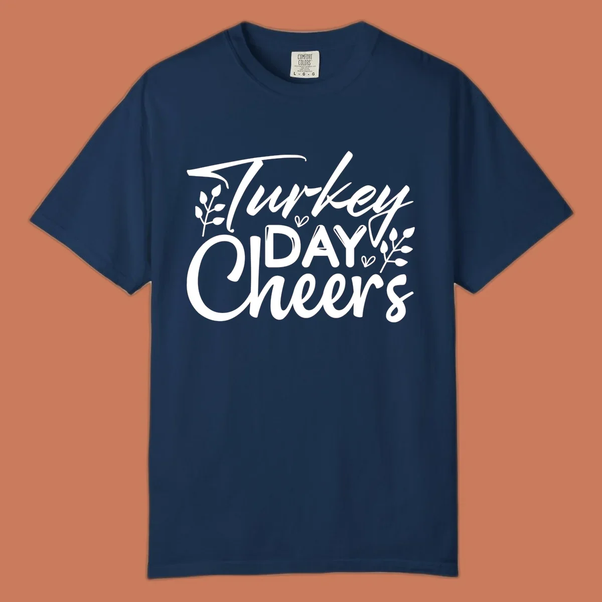 Typography design with "Turkey DAY Cheers" and decorative leaves, a Thanksgiving sentiment.