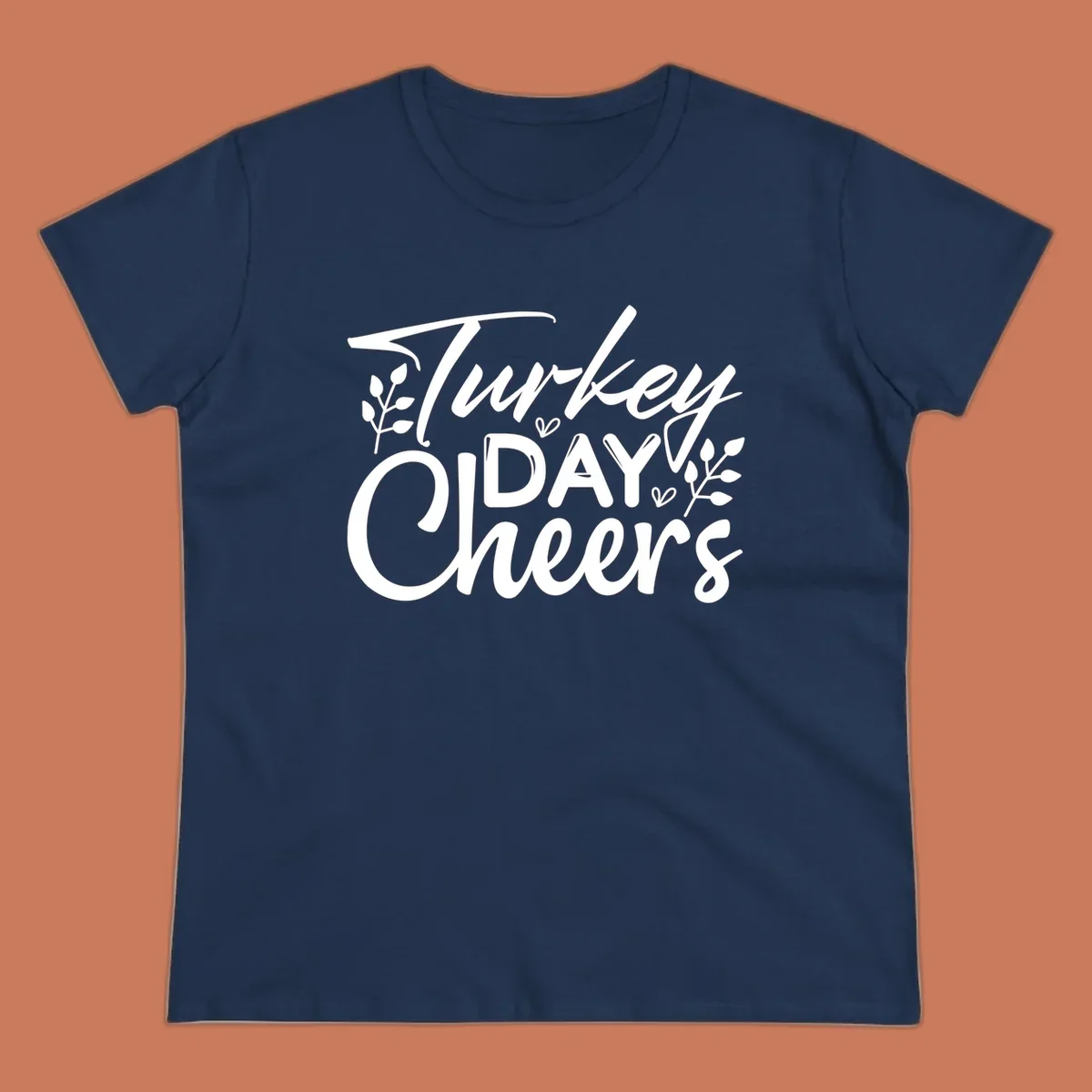 Typography design with "Turkey DAY Cheers" and decorative leaves, a Thanksgiving sentiment.