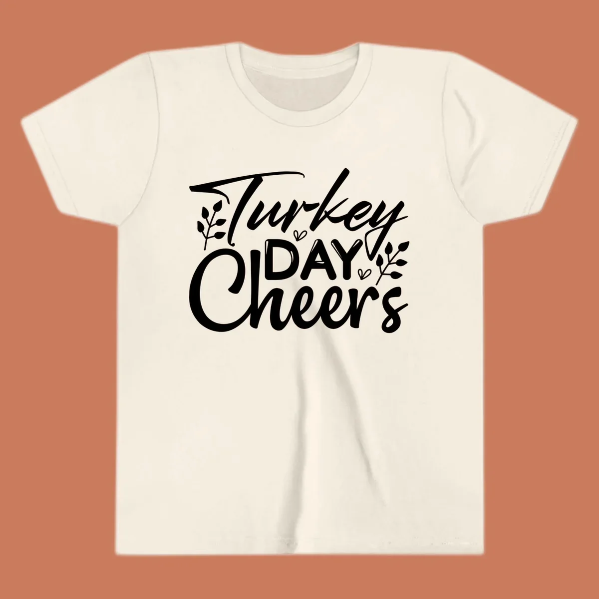 Typography design with "Turkey DAY Cheers" and decorative leaves, a Thanksgiving sentiment.