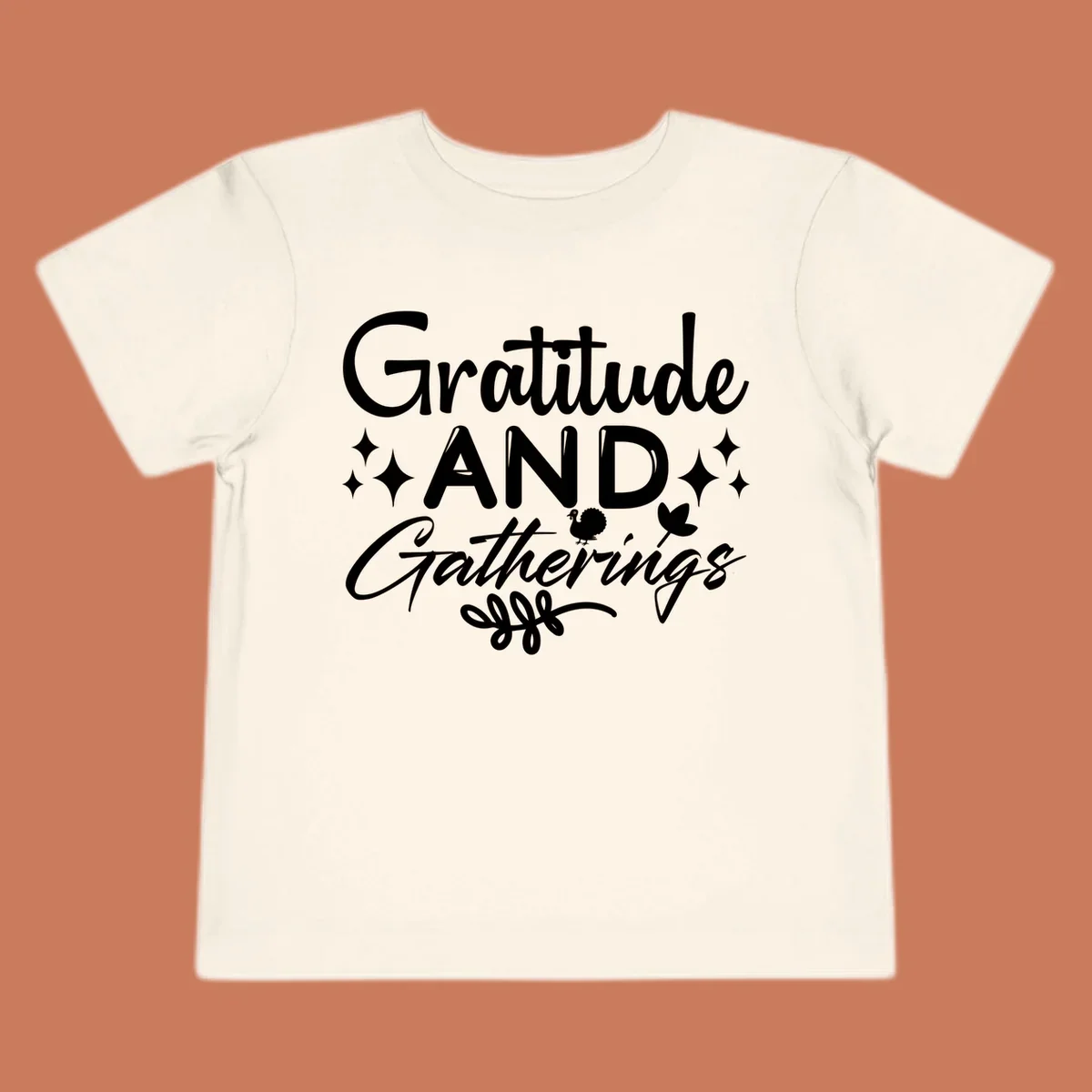 Gratitude and Gatherings text with star, turkey, and leaf elements. gratitude-gatherings.