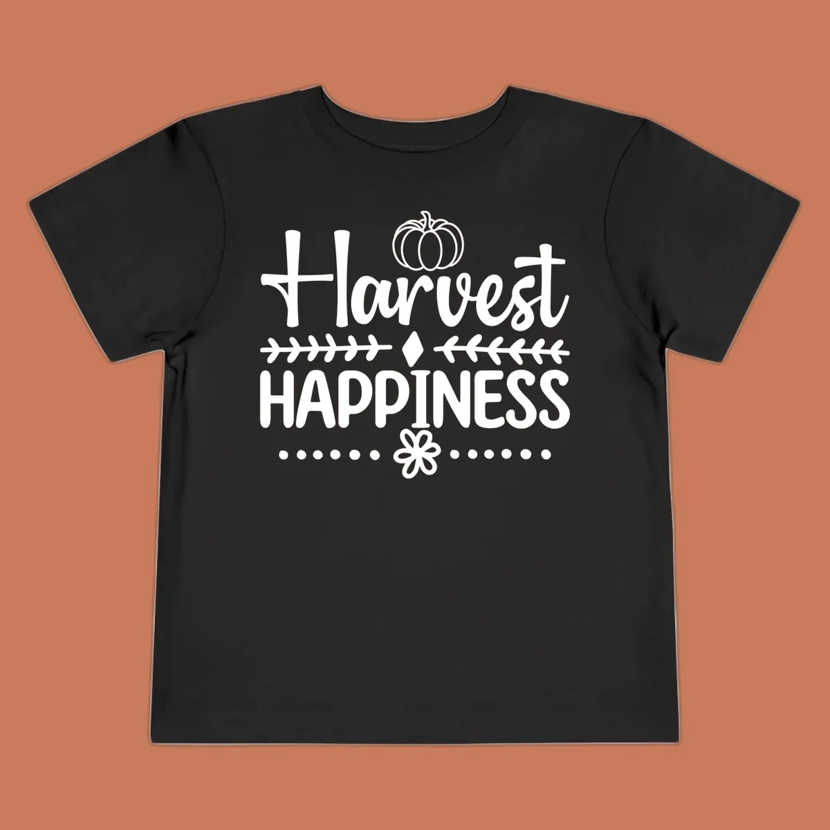 Harvest Happiness autumn sentiment design with pumpkin and floral accents.