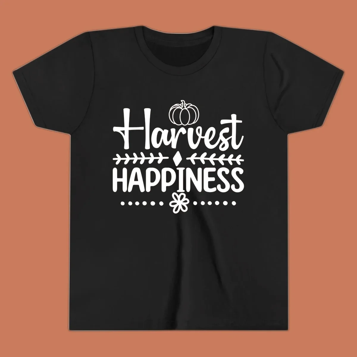 Harvest Happiness autumn sentiment design with pumpkin and floral accents.