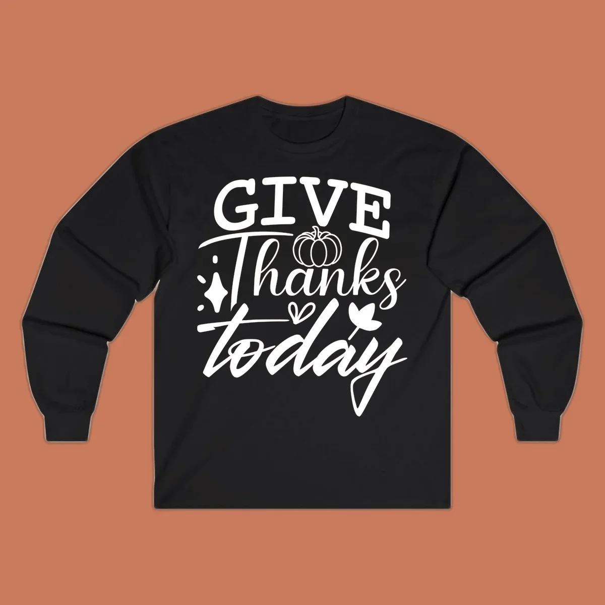 Give Thanks Today typography design with pumpkin and leaf elements.