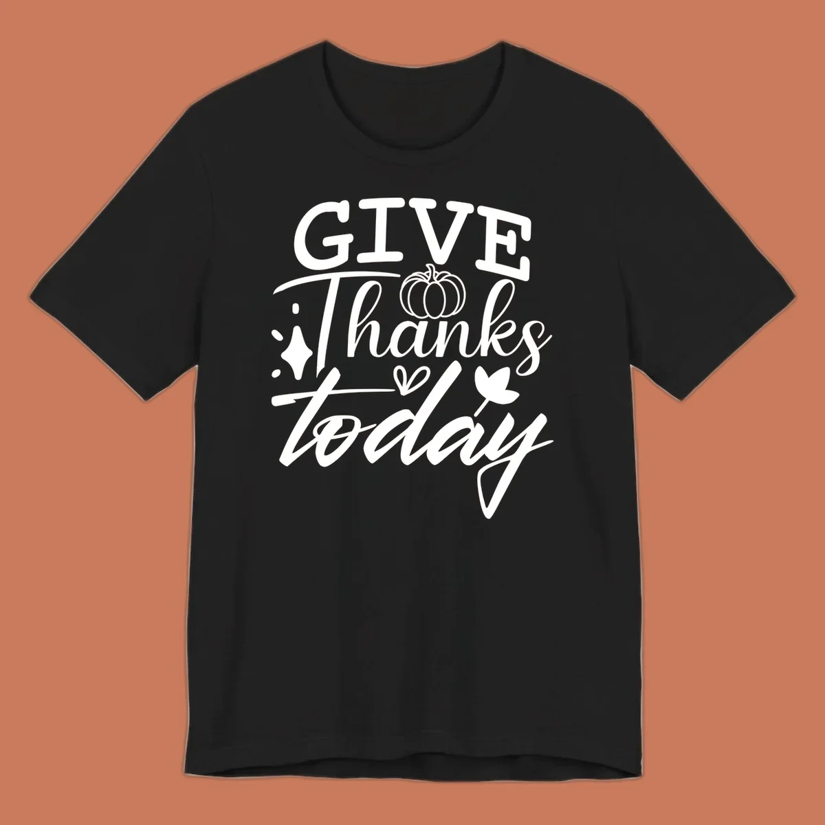 Give Thanks Today typography design with pumpkin and leaf elements.