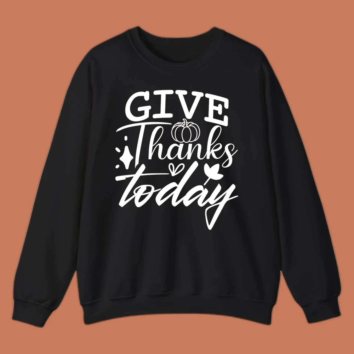 Give Thanks Today typography design with pumpkin and leaf elements.