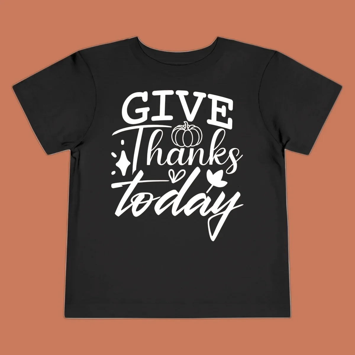 Give Thanks Today typography design with pumpkin and leaf elements.