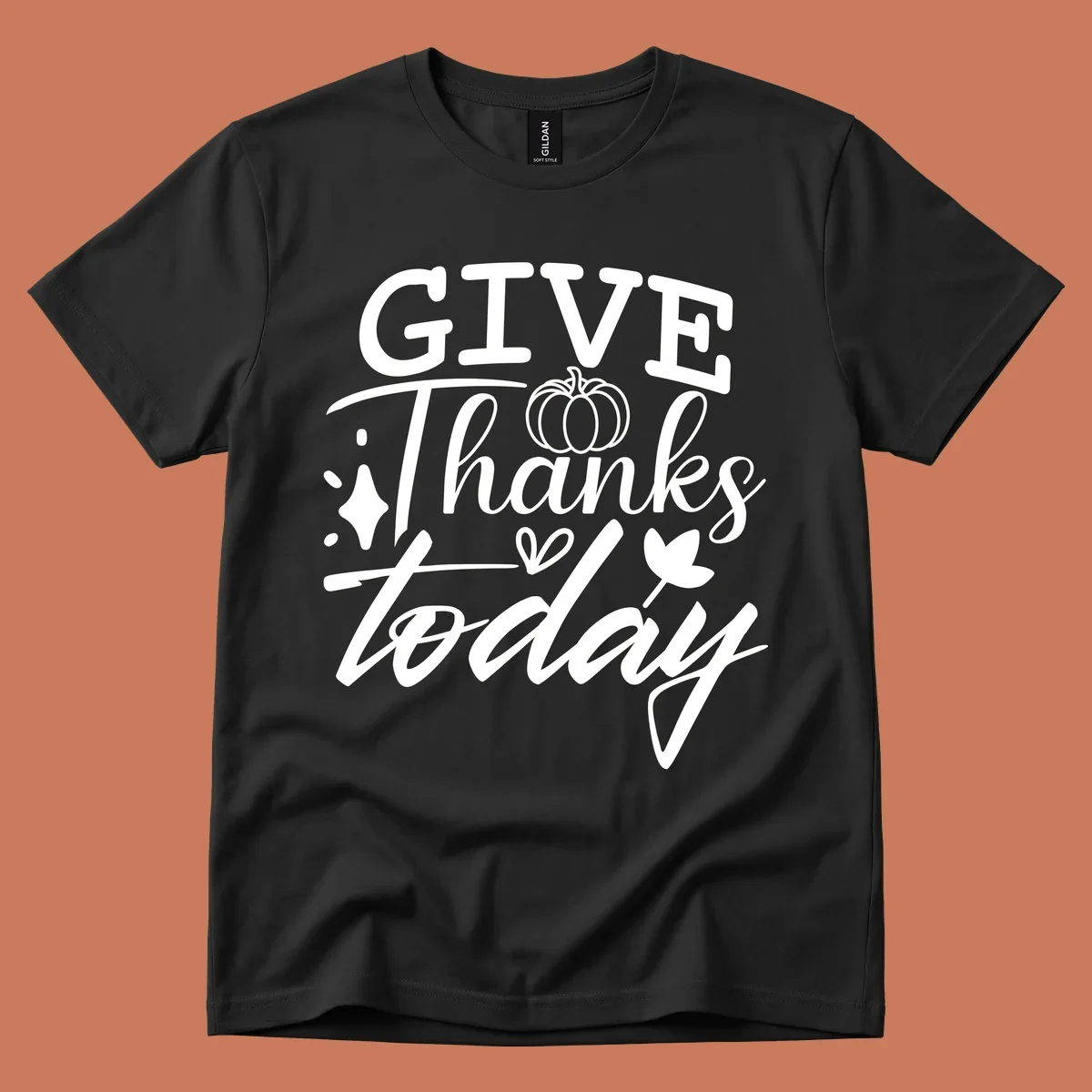 Give Thanks Today typography design with pumpkin and leaf elements.