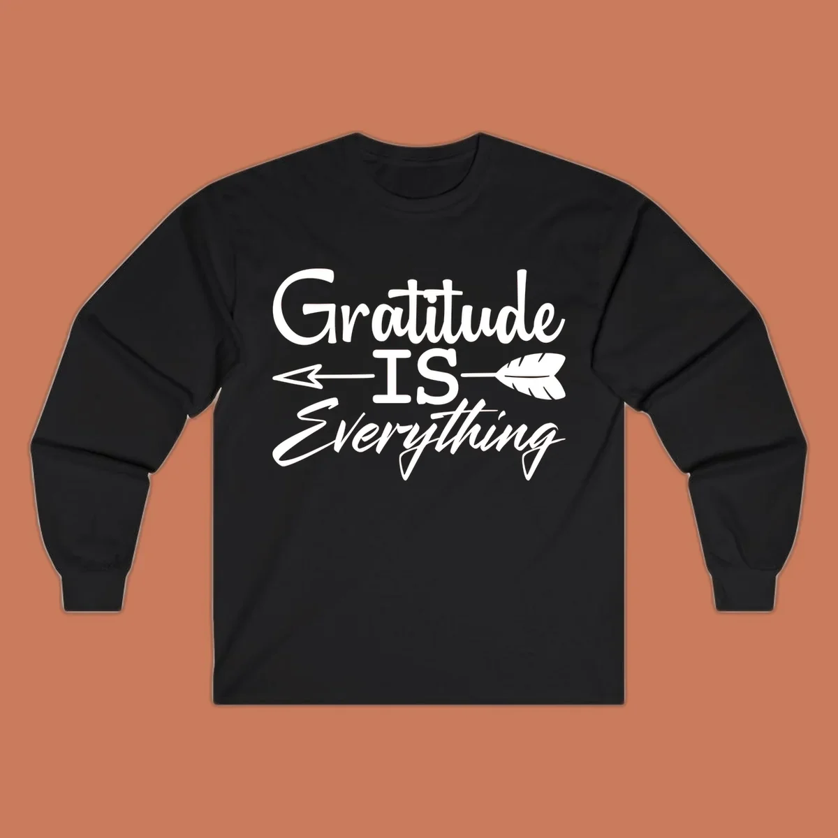 Gratitude Is Everything typography design with an arrow and feather graphic.