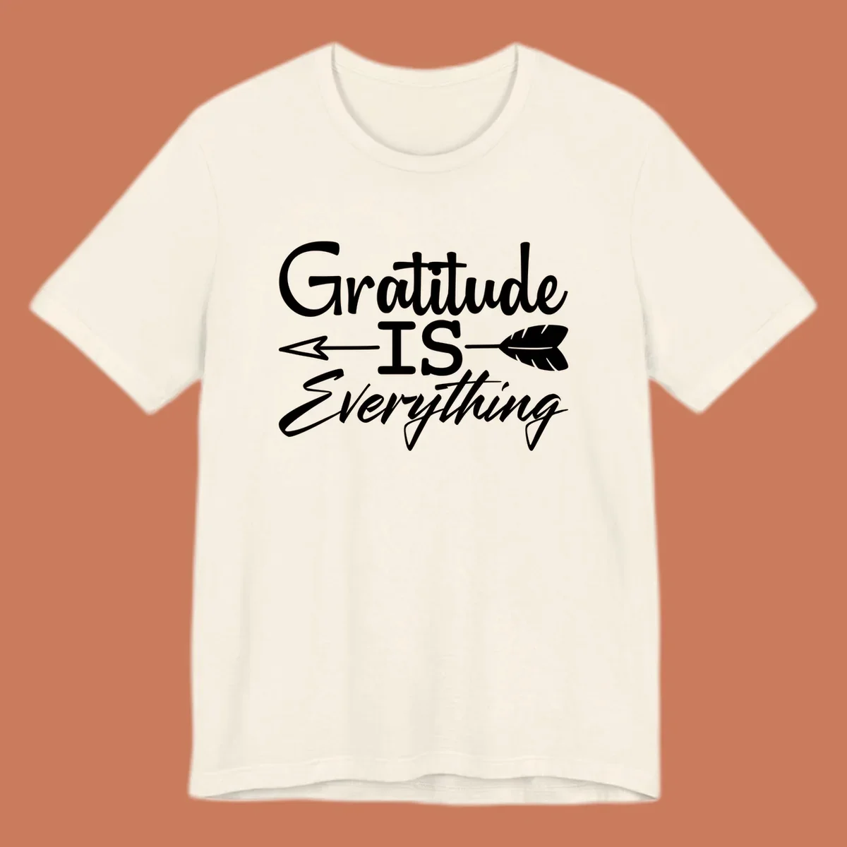 Gratitude Is Everything typography design with an arrow and feather graphic.