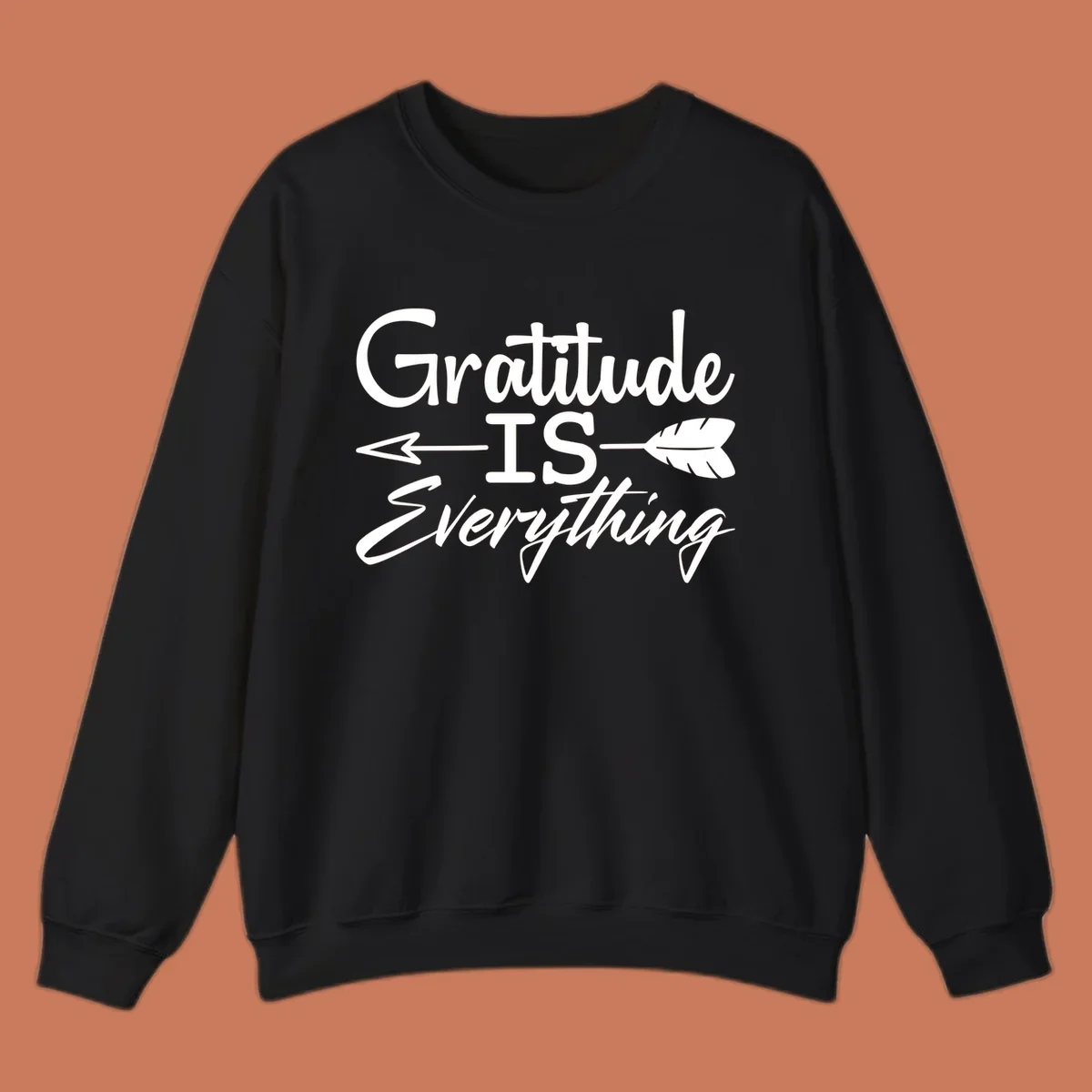 Gratitude Is Everything typography design with an arrow and feather graphic.