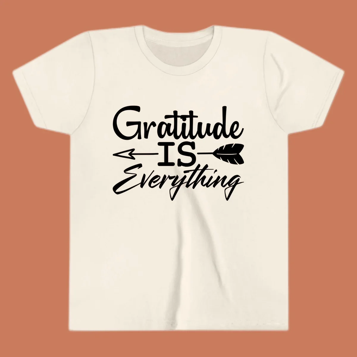 Gratitude Is Everything typography design with an arrow and feather graphic.