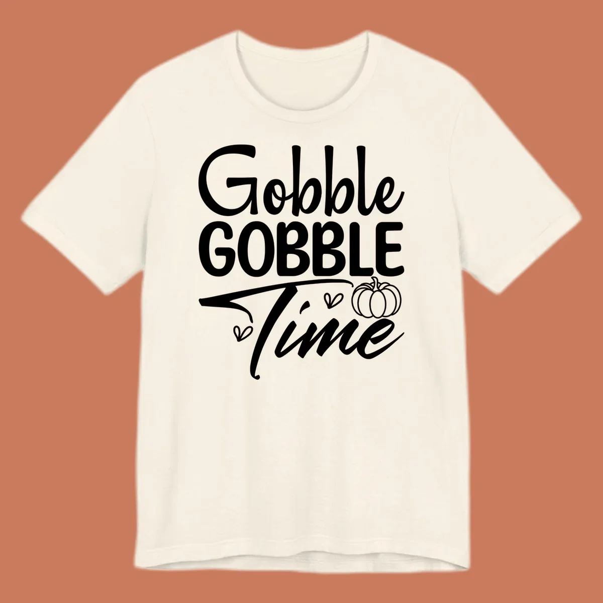 Gobble Gobble Time phrase with pumpkin and hearts, white typography on black background.