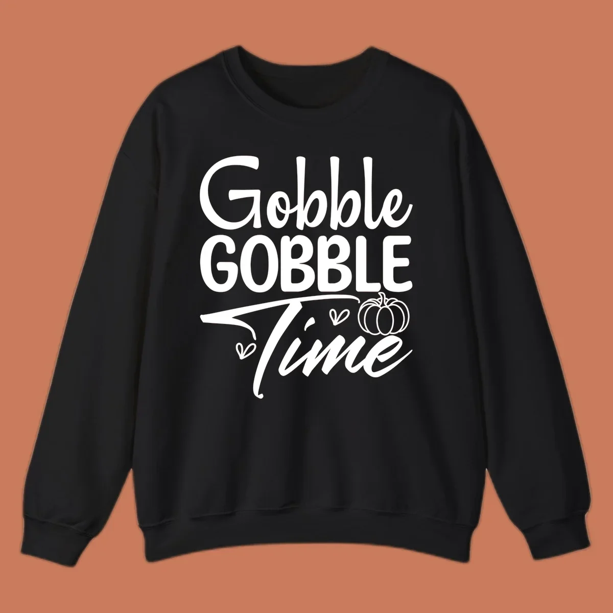 Gobble Gobble Time phrase with pumpkin and hearts, white typography on black background.