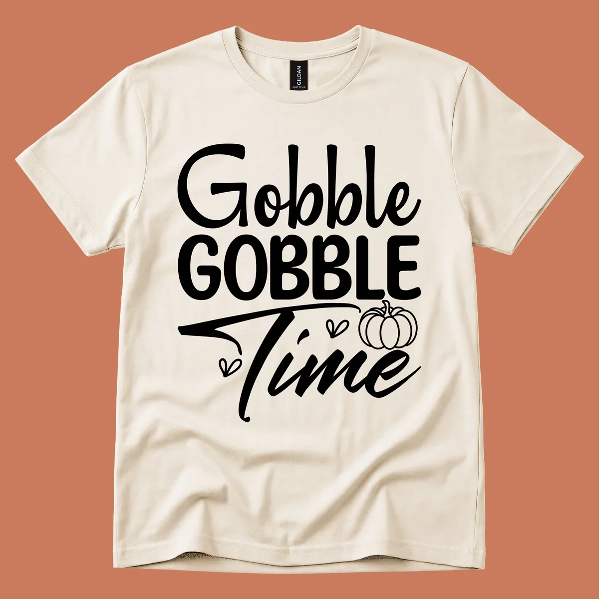 Gobble Gobble Time phrase with pumpkin and hearts, white typography on black background.