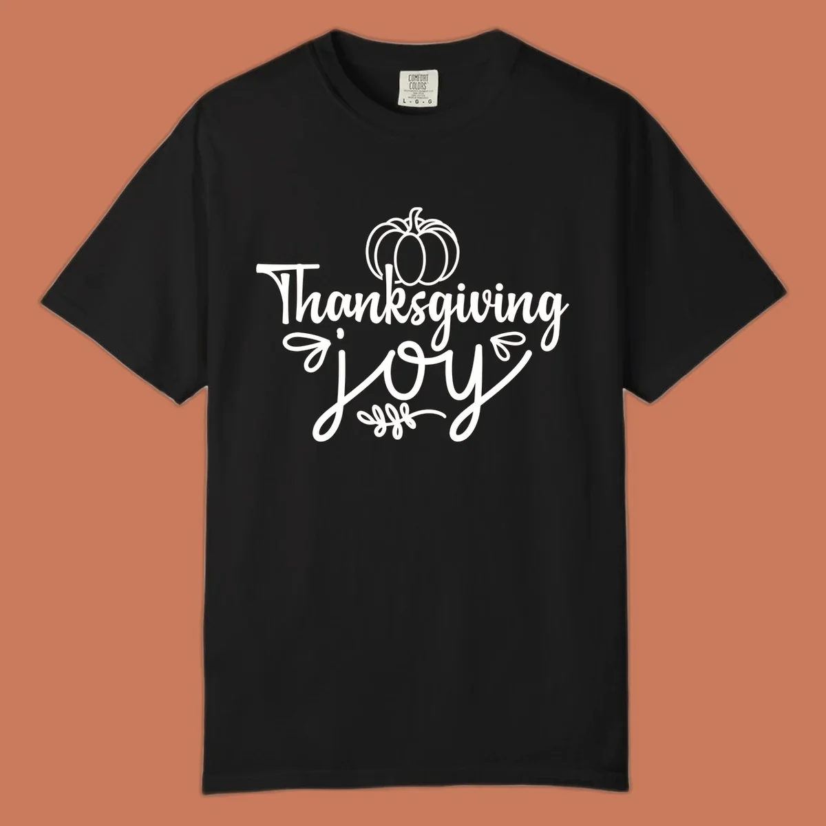 Thanksgiving Joy script text with a pumpkin illustration, for gratitude tees.