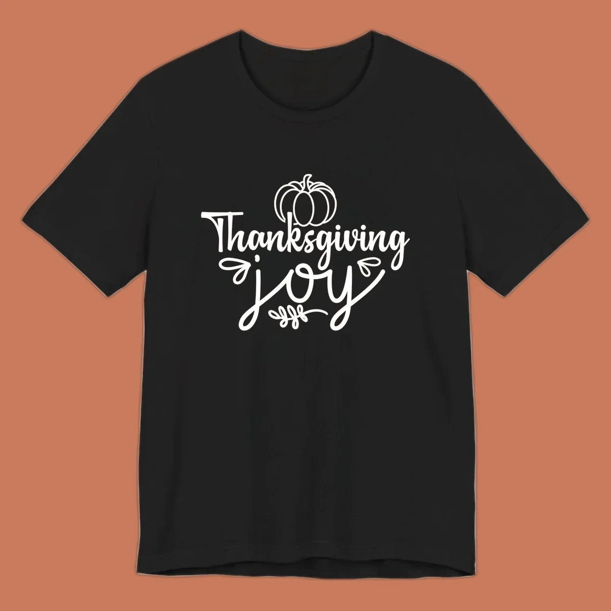 Thanksgiving Joy script text with a pumpkin illustration, for gratitude tees.