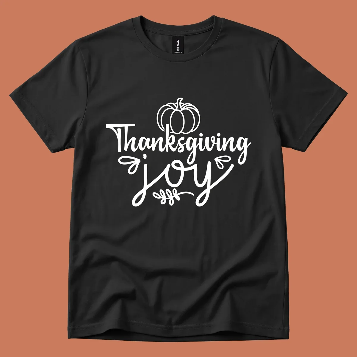 Thanksgiving Joy script text with a pumpkin illustration, for gratitude tees.