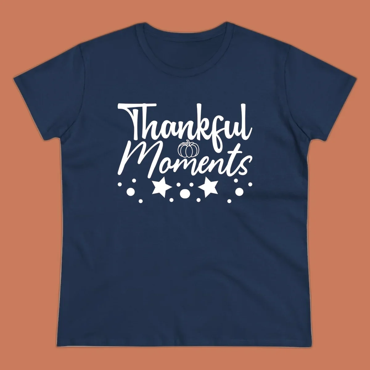 Thankful Moments autumn script text with pumpkin, stars, and dots graphic.