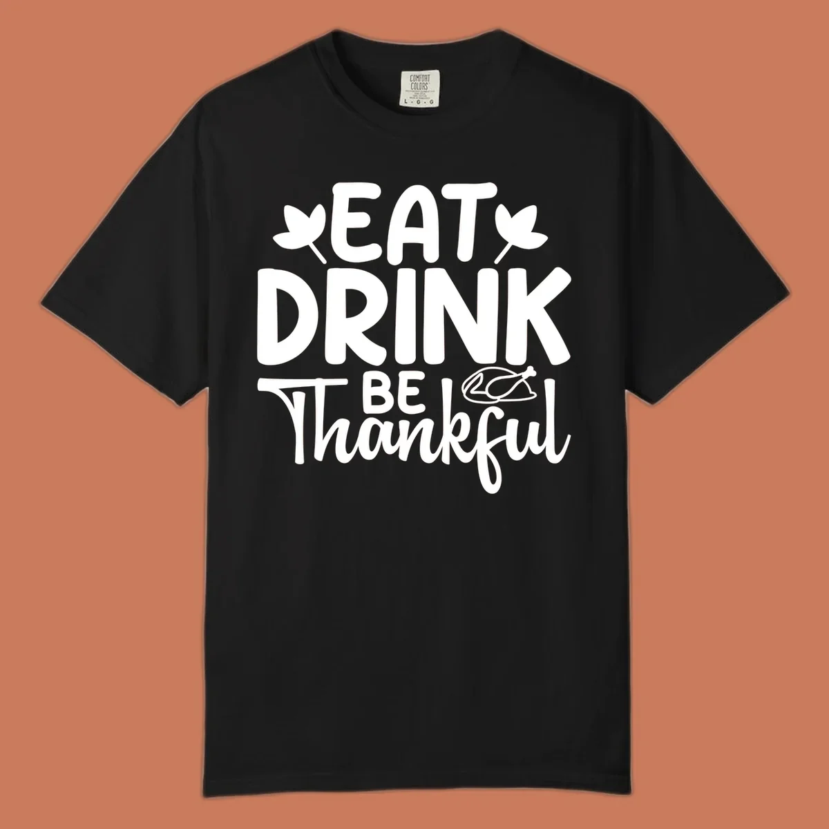 Eat Drink Be Thankful text with autumn leaves and a roasted chicken graphic.