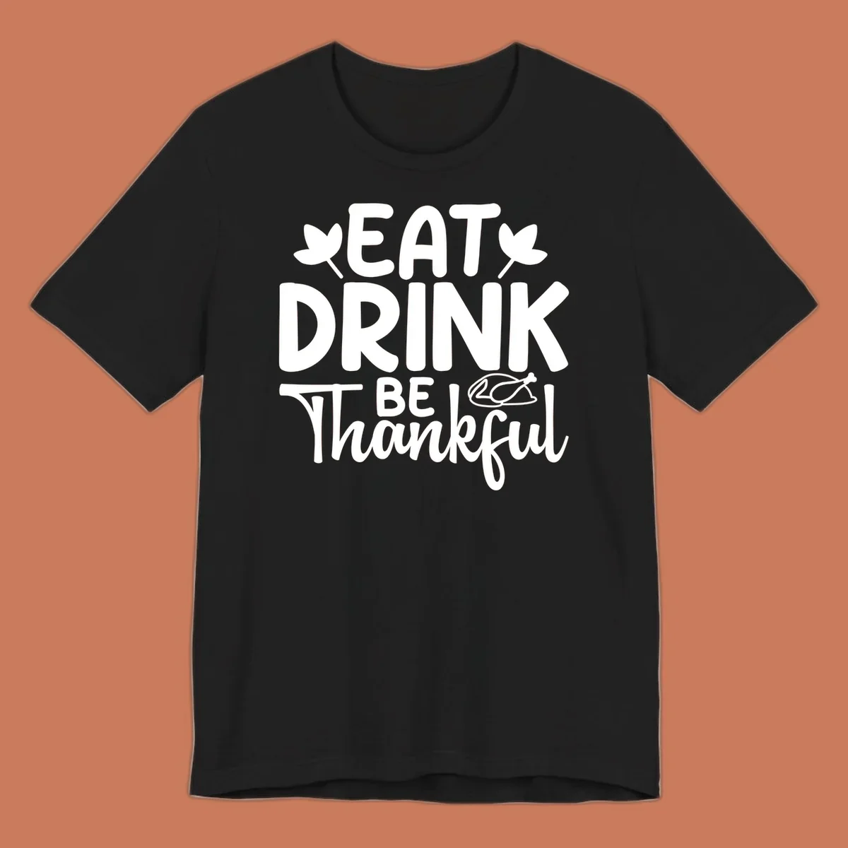 Eat Drink Be Thankful text with autumn leaves and a roasted chicken graphic.