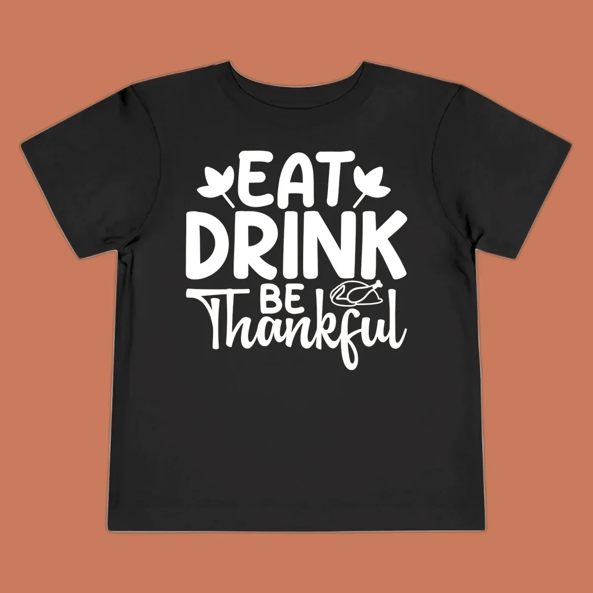 Eat Drink Be Thankful text with autumn leaves and a roasted chicken graphic.