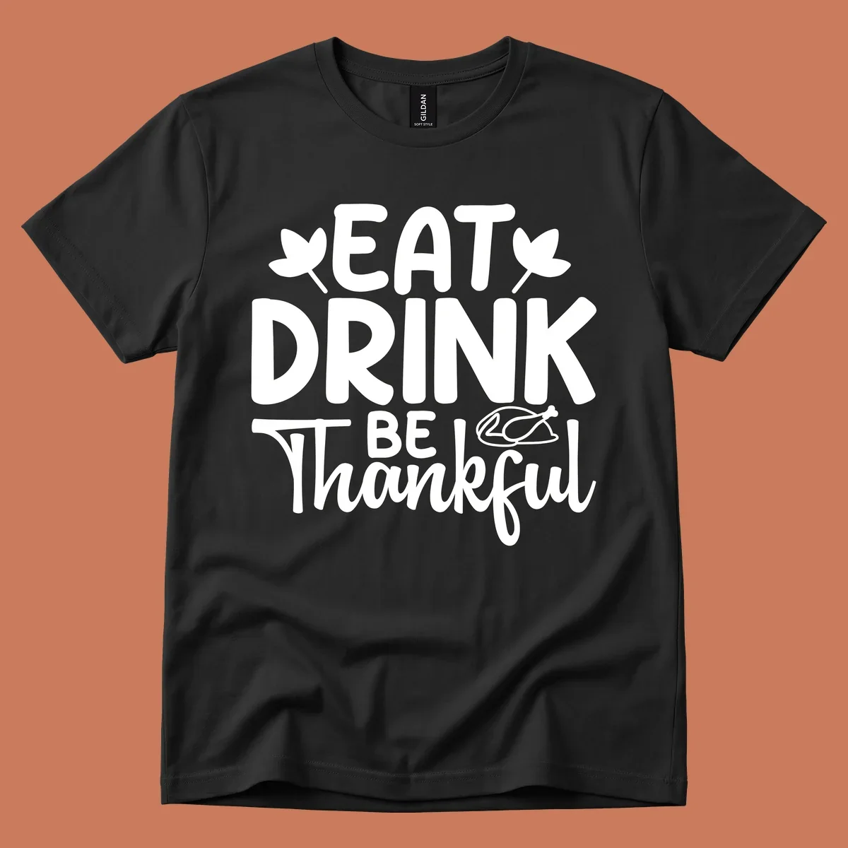 Eat Drink Be Thankful text with autumn leaves and a roasted chicken graphic.