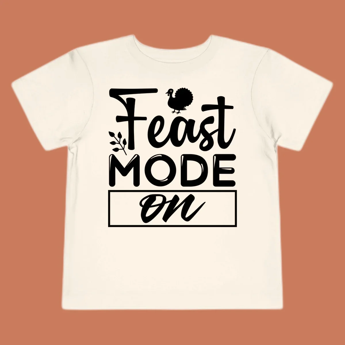 Feast Mode On text with a turkey illustration, Thanksgiving graphic tee design.