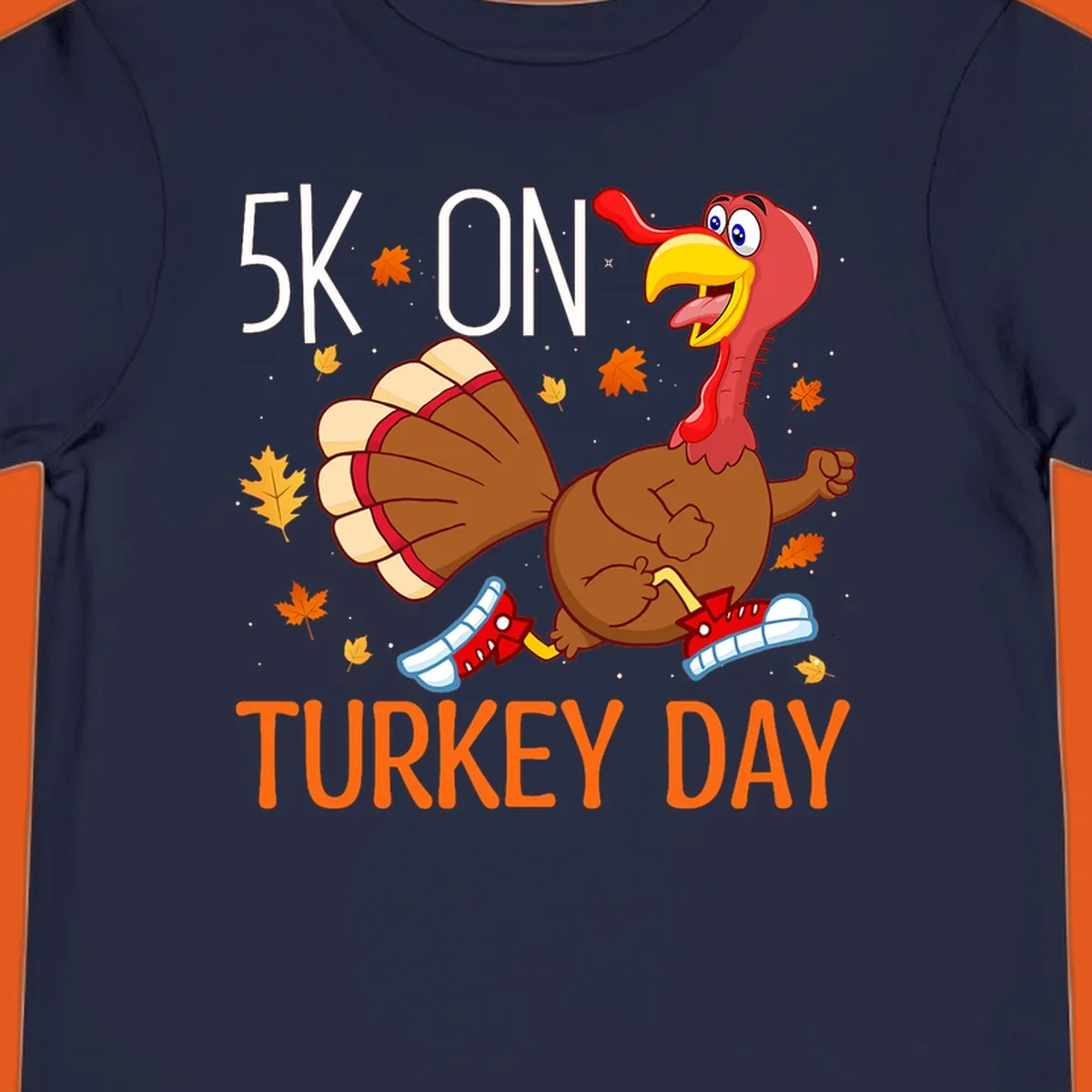 Running turkey illustration with "5K ON TURKEY DAY" text for Turkey Trot shirts.