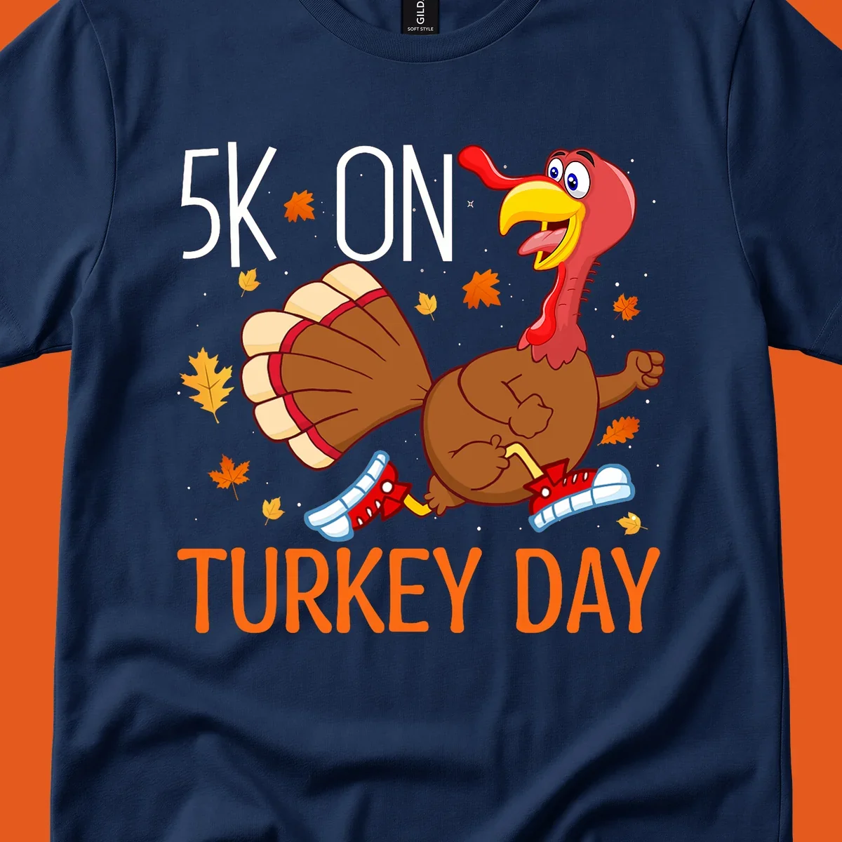 Running turkey illustration with "5K ON TURKEY DAY" text for Turkey Trot shirts.